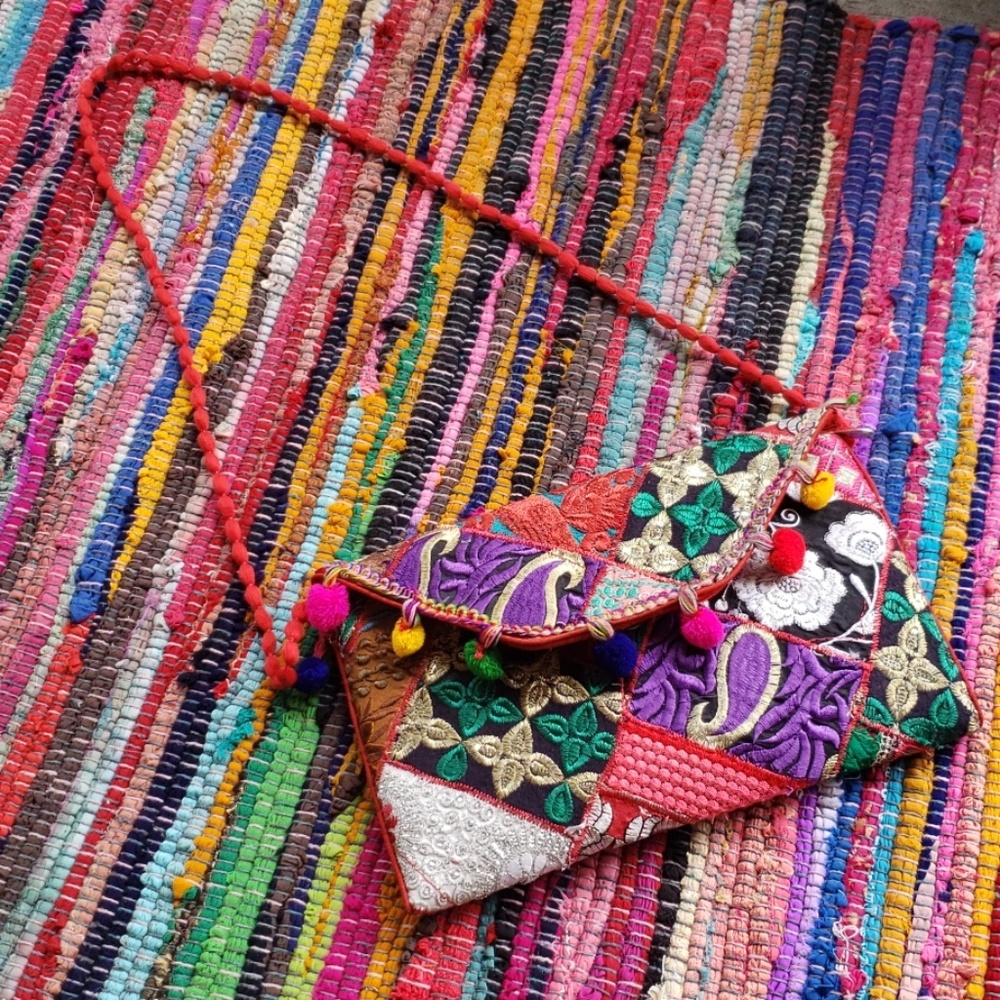 Multi colored pompom party purse